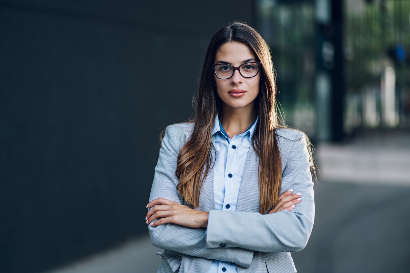 Business woman standing outside the office building