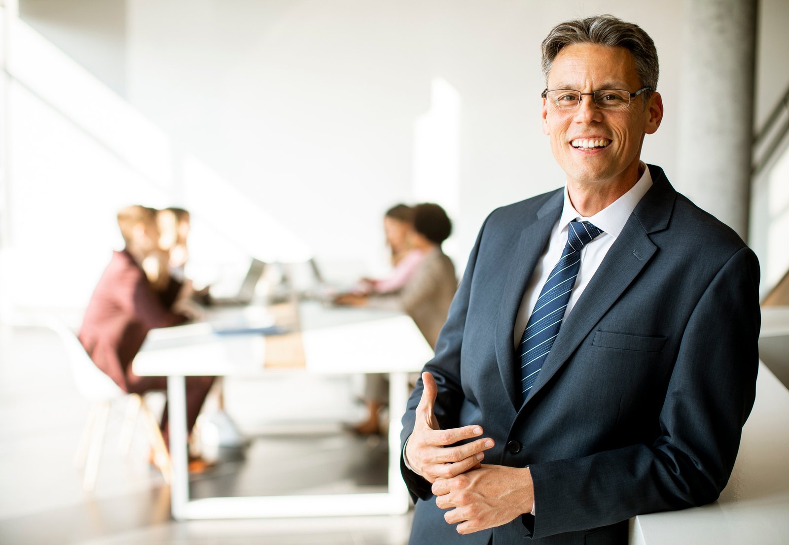 Handsome business man standing in the office